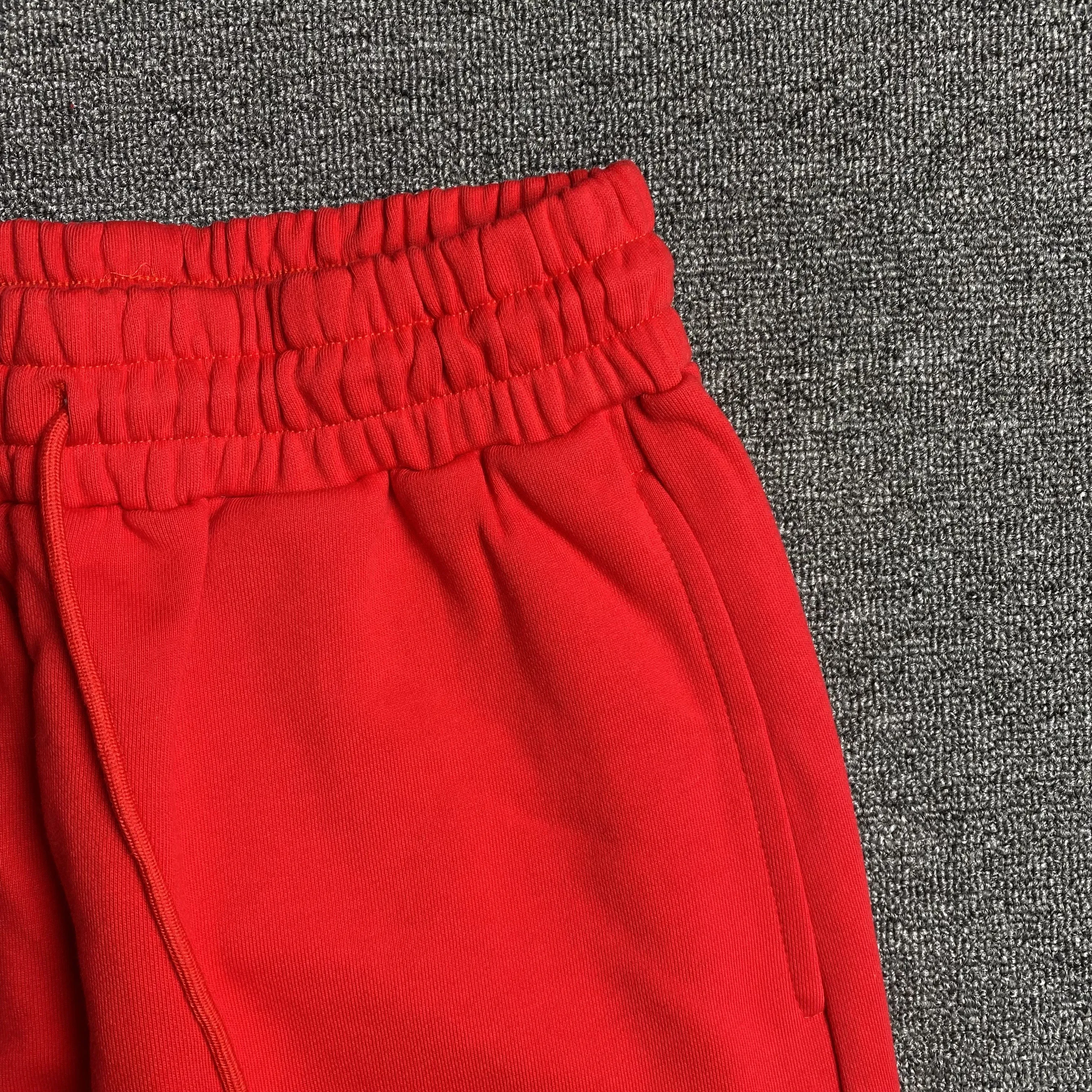 DENIM TEARS COTTON WREATH SWEATPANTS RED