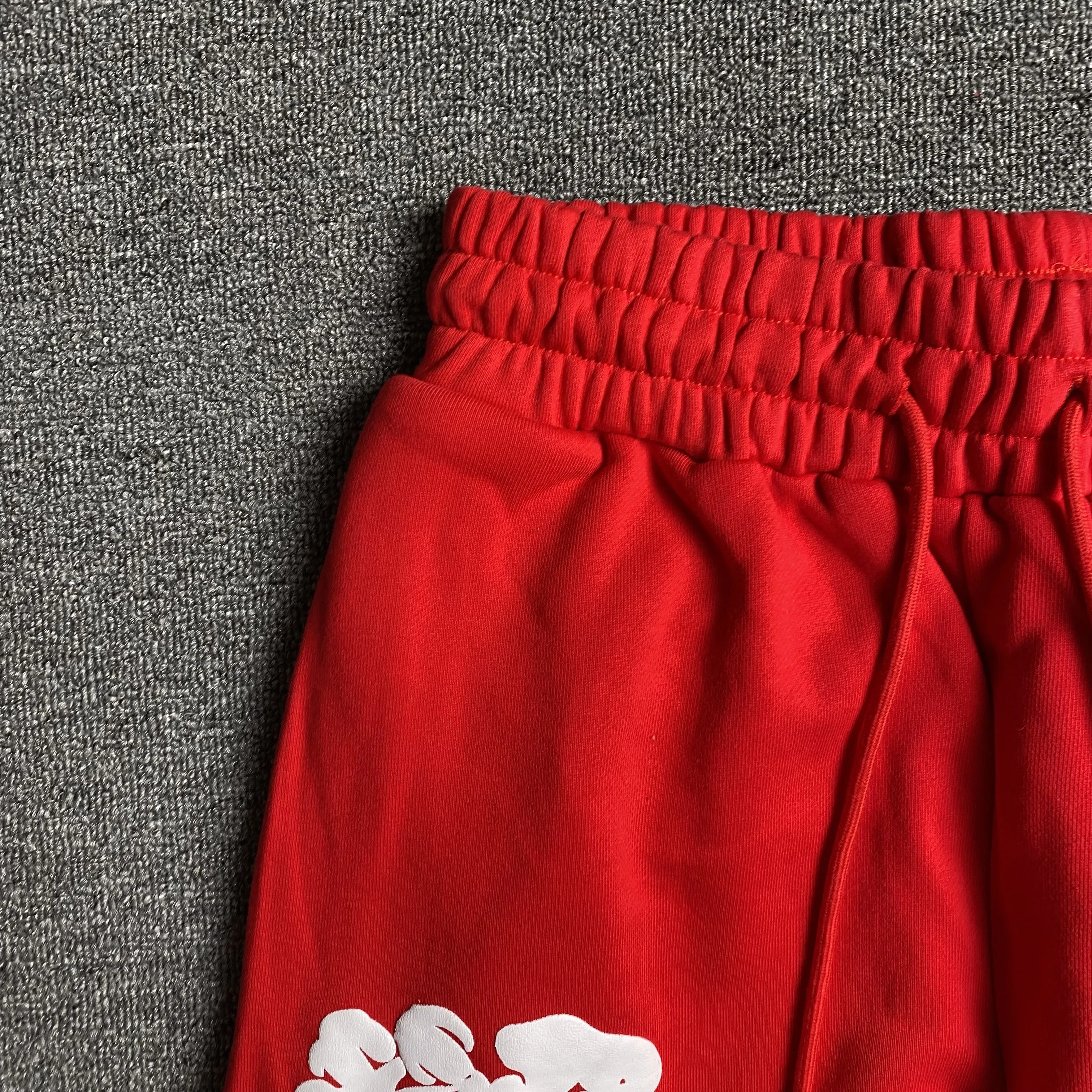 DENIM TEARS COTTON WREATH SWEATPANTS RED